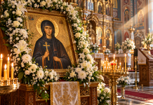 14 octombrie, sărbătoare cu cruce roșie! Sfânta Parascheva, sprijin pentru cei aflați în necaz. Ce este bine să faci în această zi Icoana Sfintei Cuvioase Parascheva, împodobită cu flori albe, într-o biserică ortodoxă